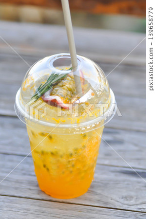 passion fruit juice , passion fruit soda or mocktail or cocktail 139658779