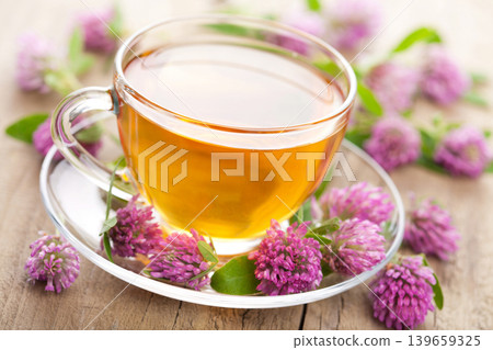 Herbal Clover Tea in Glass Cup with Fresh Flowers Herbal Clover Tea in Glass Cup with Fresh Flowers 139659325