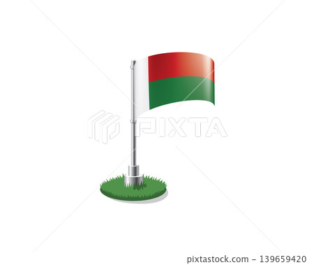 Madagascar flag on a flagpole mounted on the grass Madagascar flag on a flagpole mounted on the grass 139659420