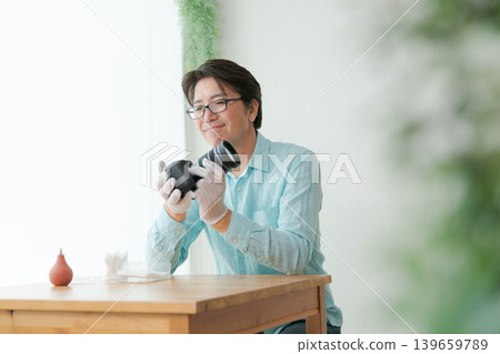 A man who takes care of the camera A man who takes care of the camera 139659789