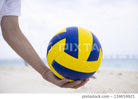 Enjoying beach volleyball Enjoying beach volleyball 139659925
