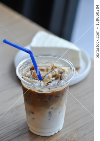 iced coffee , iced latte coffee or iced cappuccino coffee and coconut cake 139660284