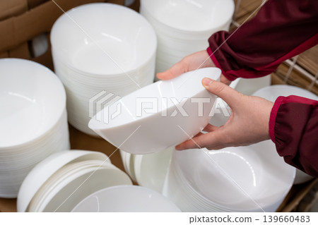 Boxes of white plates in crockery shop, dishware, tableware stack in store Boxes of white plates in crockery shop, dishware, tableware stack in store 139660483