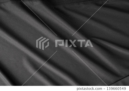 Sport cloth fabric texture background, black soccer shirt pattern Sport cloth fabric texture background, black soccer shirt pattern 139660549
