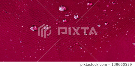 Waterproof fabric texture with rain drops closeup Waterproof fabric texture with rain drops closeup 139660559