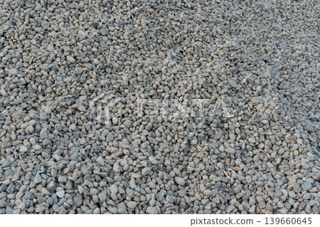 Construction gravel pattern, crushed grey stone textured background Construction gravel pattern, crushed grey stone textured background 139660645