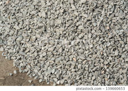 Construction gravel pattern, crushed grey stone textured background Construction gravel pattern, crushed grey stone textured background 139660653