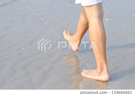 walking on the beach, beach and sand or sea or leg and feet walking on the beach, beach and sand or sea or leg and feet 139660883