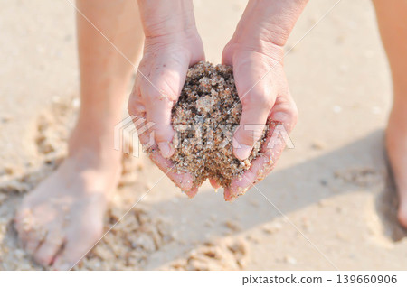 sand, holding sand or beach sand or sea sand or play sand sand, holding sand or beach sand or sea sand or play sand 139660906