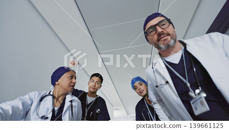 Pov, doctors and team push patient for emergency, surgery or operation in hospital. Low angle, surgeon group and rush to ICU, talking and help for medical treatment, healthcare support and wellness Pov, doctors and team push patient for emergency, surgery or operation in hospital. Low angle, surgeon group and rush to ICU, talking and help for medical treatment, healthcare support and wellness 139661125