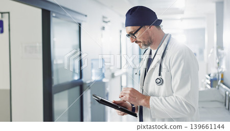 Man, doctor and tablet for hospital, healthcare or clinic research, online planning and schedule management. Medical professional or surgeon typing on digital technology for surgery results or data Man, doctor and tablet for hospital, healthcare or clinic research, online planning and schedule management. Medical professional or surgeon typing on digital technology for surgery results or data 139661144