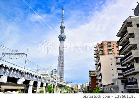 Tokyo Skytree as seen from the bridge along the Kitajikken River promenade. 139661183