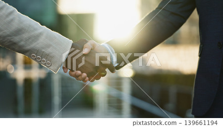 Business people, shaking hands and city meeting for b2b partnership, outdoor deal and travel success. Corporate or professional clients handshake for consulting, welcome or introduction in urban town Business people, shaking hands and city meeting for b2b partnership, outdoor deal and travel success. Corporate or professional clients handshake for consulting, welcome or introduction in urban town 139661194