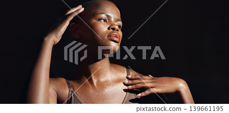 Face, vision and beauty with a natural black woman on a dark background in studio for feminine wellness. Hands, skincare and thinking with a young model touching her body or skin in satisfaction Face, vision and beauty with a natural black woman on a dark background in studio for feminine wellness. Hands, skincare and thinking with a young model touching her body or skin in satisfaction 139661195