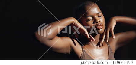 Face, hands and beauty with a natural black woman on a dark background in studio for feminine wellness. Arms, skincare and aesthetic with a confident model touching her body or skin in satisfaction 139661199
