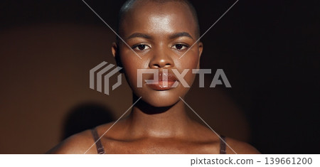 Face, vision and beauty with a natural black woman on a dark background in studio for feminine wellness. Hands, skincare and thinking with a young model touching her body or skin in satisfaction Face, vision and beauty with a natural black woman on a dark background in studio for feminine wellness. Hands, skincare and thinking with a young model touching her body or skin in satisfaction 139661200