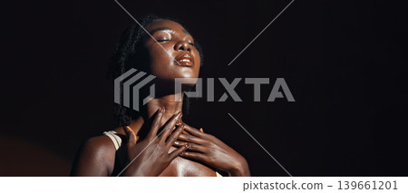 Face, hands and skincare with a natural black woman on a dark background in studio for feminine wellness. Arms, beauty and spa with a confident young model touching her body or skin in satisfaction 139661201