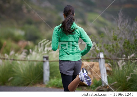 Back, road and running with woman, fitness and morning with fresh air and exercise for health, wellness and cardio. Person, runner or athlete with workout or training with nature, energy or challenge 139661245