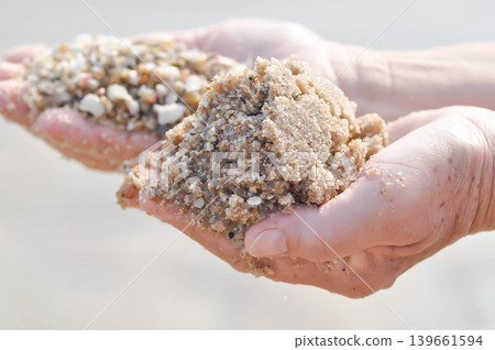 sand, holding sand or beach sand or sea sand or play sand sand, holding sand or beach sand or sea sand or play sand 139661594