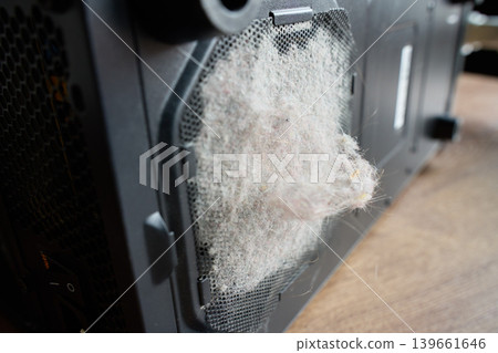 Dust buildup on desktop computer case ventilation grille Dust buildup on desktop computer case ventilation grille 139661646