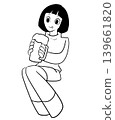 A woman with a beer mug 139661820