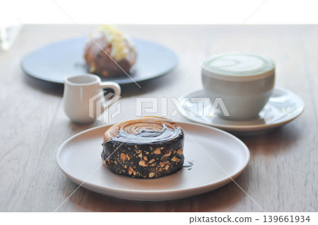 timber ring or chocolate timber ring or bread or round croissant and matcha latte timber ring or chocolate timber ring or bread or round croissant and matcha latte 139661934