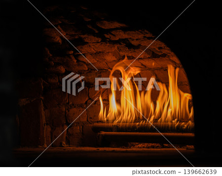 a burning fireplace in winter a burning fireplace in winter 139662639