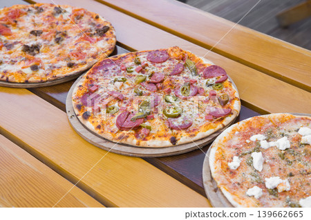 Fresh Italian pizza out of the oven Fresh Italian pizza out of the oven 139662665