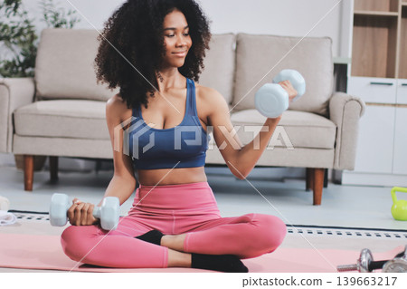 Women exercising in fitness studio yoga classes Women exercising in fitness studio yoga classes 139663217