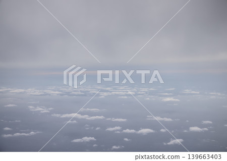 Soft Cloud Layers Floating Above Calm Ocean Soft Cloud Layers Floating Above Calm Ocean 139663403