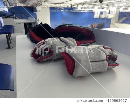 hockey guard and skates in ice stadium hockey guard and skates in ice stadium 139663617