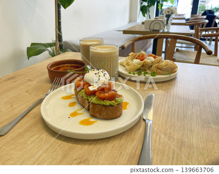 a salmon bruschetta plate and pancakes with salmon plate on the a salmon bruschetta plate and pancakes with salmon plate on the 139663706