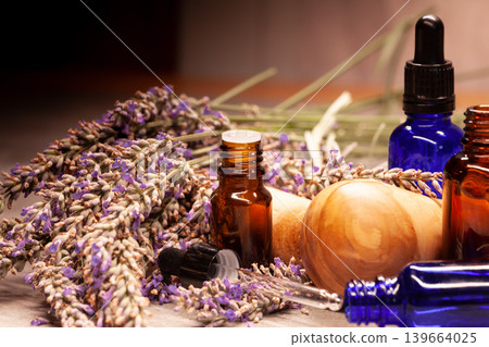 Essential oil bottles with lavender and natural ingredients 139664025