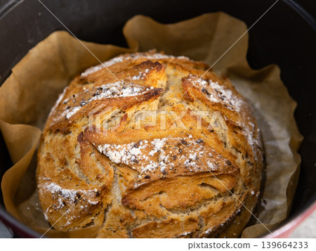 Homemade seeded sourdough bread baked in Dutch oven Homemade seeded sourdough bread baked in Dutch oven 139664233