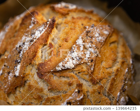 Homemade seeded sourdough bread baked in Dutch oven Homemade seeded sourdough bread baked in Dutch oven 139664235