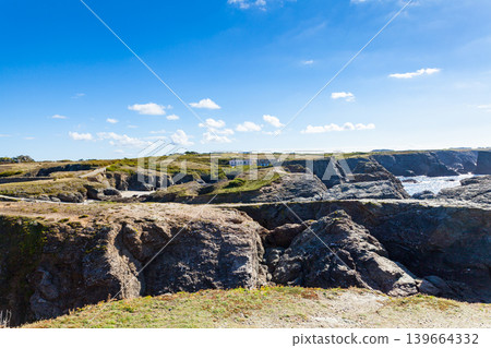 The rocks and cliffs in the ocean of the famous island Belle Ile en Mer in France The rocks and cliffs in the ocean of the famous island Belle Ile en Mer in France 139664332