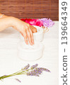 Preparing a woman's hands for a manicure 139664349