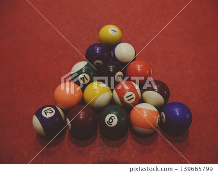 billiard balls on red pool table billiard balls on red pool table 139665799