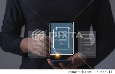 Young man with smartphone mobile hand using a pen touching to sign a Online Business Contract Young man with smartphone mobile hand using a pen touching to sign a Online Business Contract 139665911