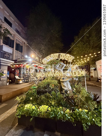 Ho Chi Minh City's night market and illuminated cityscape 139665997