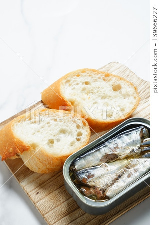Sardines in Oil and Baguette - Sardines marinated in olive oil and freshly baked baguette Sardines in Oil and Baguette - Sardines marinated in olive oil and freshly baked baguette 139666227