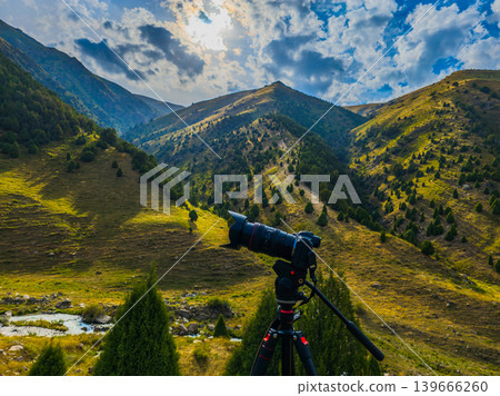 Mirrorless Camera on Tripod in Mountain Landscape Mirrorless Camera on Tripod in Mountain Landscape 139666260