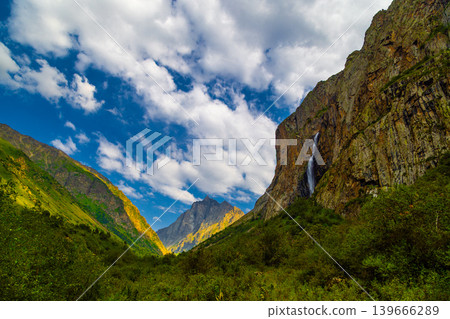 Mountain landscape with waterfall and rocky cliffs Mountain landscape with waterfall and rocky cliffs 139666289