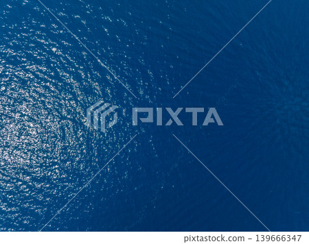 Aerial view of sunlight reflecting on ocean water surface 139666347