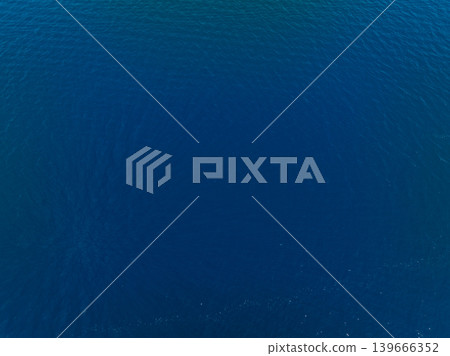 Aerial view of ocean water ripples in bright daylight Aerial view of ocean water ripples in bright daylight 139666352