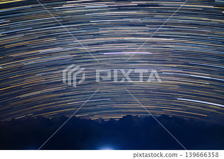 Starry night mountain range with star trails in the sky, 50mm lens angle Starry night mountain range with star trails in the sky, 50mm lens angle 139666358
