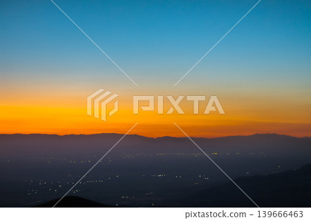 Twilight Sky Over Distant Bishkek City Lights and Mountain Range Twilight Sky Over Distant Bishkek City Lights and Mountain Range 139666463