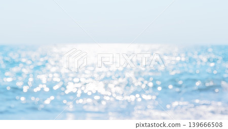 Abstract soft focus view of the sea with sparkling sunlight reflections near the beach in Phuket, Thailand. Abstract soft focus view of the sea with sparkling sunlight reflections near the beach in Phuket, Thailand. 139666508