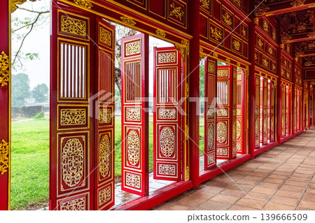 Traditional red and gold wooden doors inside the Forbidden Purple City in the Imperial City of Hue, Vietnam. Traditional red and gold wooden doors inside the Forbidden Purple City in the Imperial City of Hue, Vietnam. 139666509