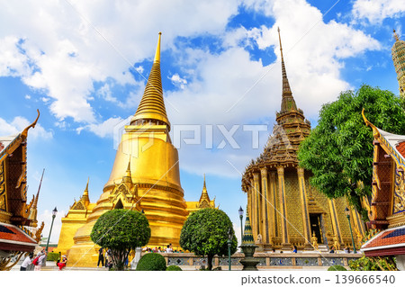 Stunning view of Wat Phra Kaew in Bangkok, Thailand, featuring golden stupas and intricate temple architecture. Stunning view of Wat Phra Kaew in Bangkok, Thailand, featuring golden stupas and intricate temple architecture. 139666540
